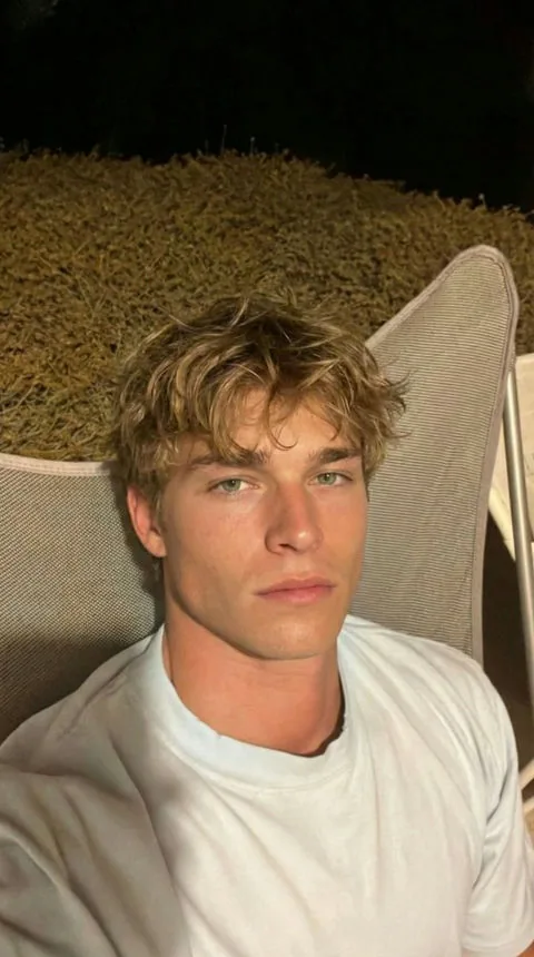 Finn, relaxed blonde AI boyfriend character outdoors