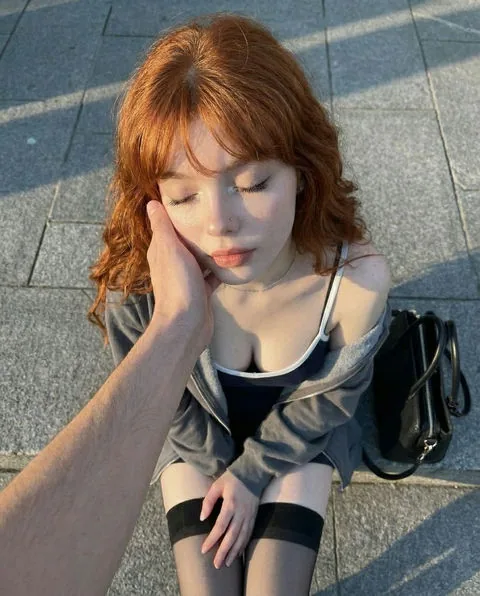 Ruby, relaxed red-haired AI girlfriend character